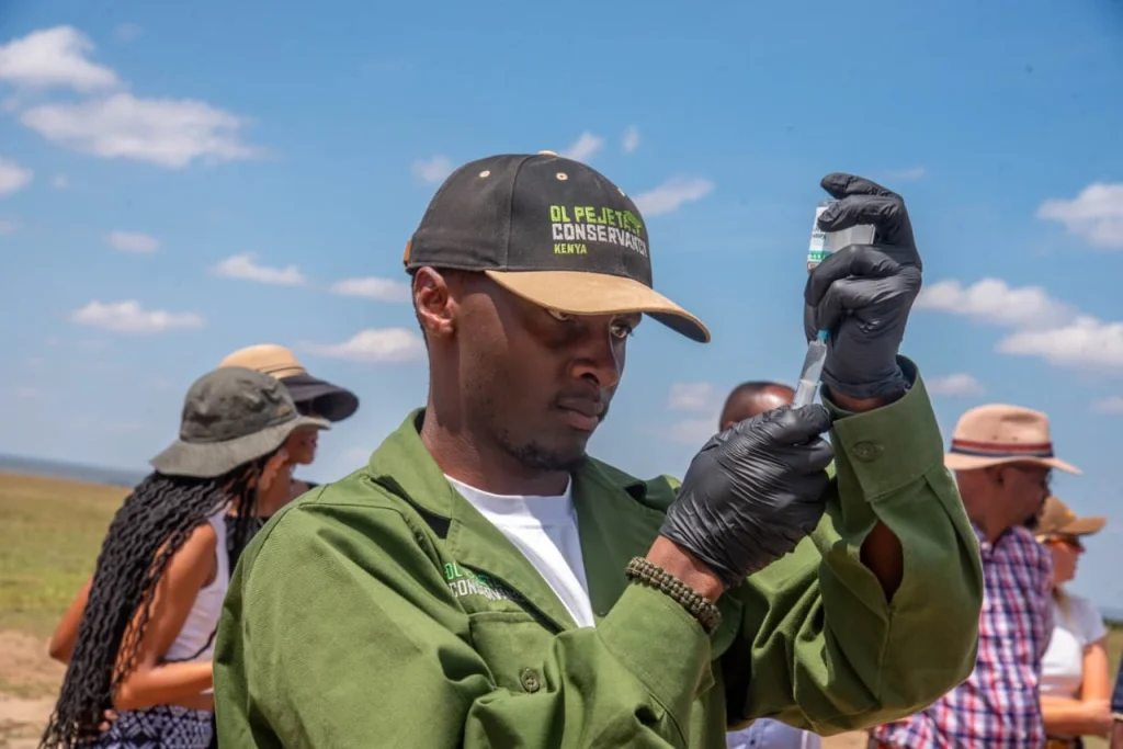 Man preparing vaccine in outdoor setting
